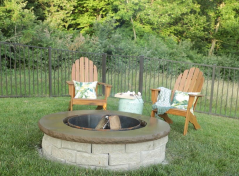 Stone fire pit with aluminum fence
