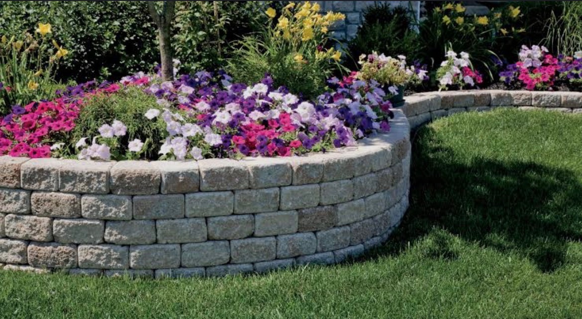Curved block retaining wall with flowers